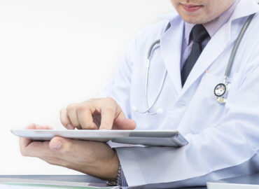 Doctor Using Reporting Software